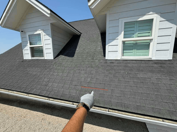 Shingle roof marked for replacement before repair